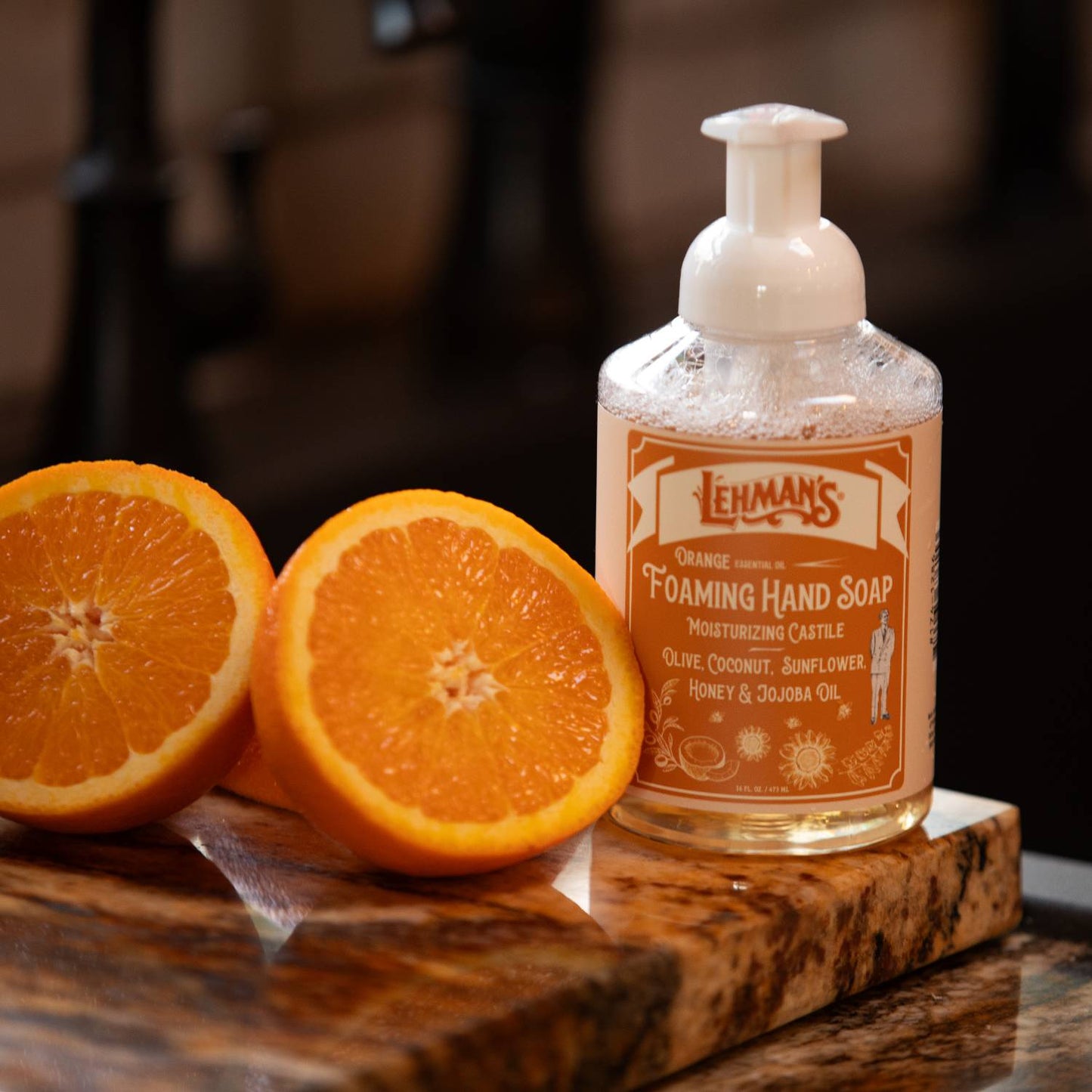 Clear pump bottle of handcrafted orange-scented moisturizing foaming hand soap with natural oils including olive, coconut, sunflower, honey, and jojoba, made in USA, featured in Health & Wellness, Grooming and Personal Hygiene, Soaps and Soapmaking collections.