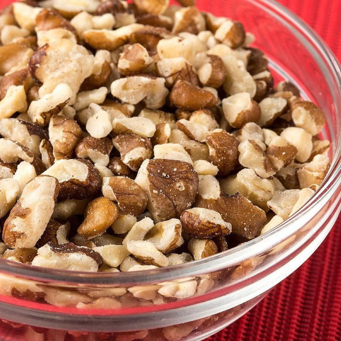 Clear glass bowl filled with shelled black walnuts, showcasing natural texture and rich color, perfect for baking or snacking, featured in Kitchen & Food, Snacks and Sweets, USA Made, and Best Sellers collections.