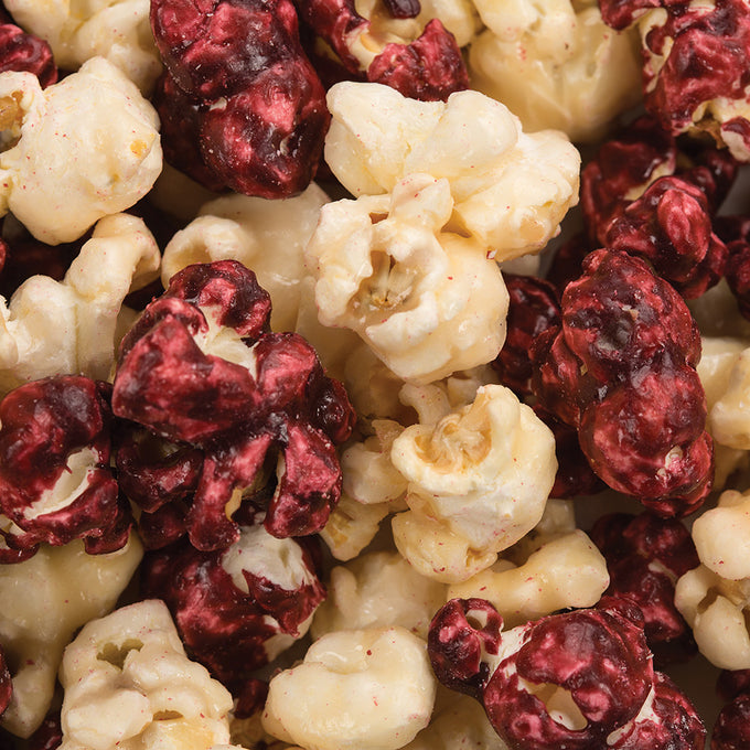 Close-up of handcrafted popcorn in vibrant white and deep burgundy hues, made in USA by a family-owned Amish Country shop, perfect for Kitchen & Food, Snacks and Sweets, Popcorn, USA Made, Best Sellers, and Promo Eligible collections.