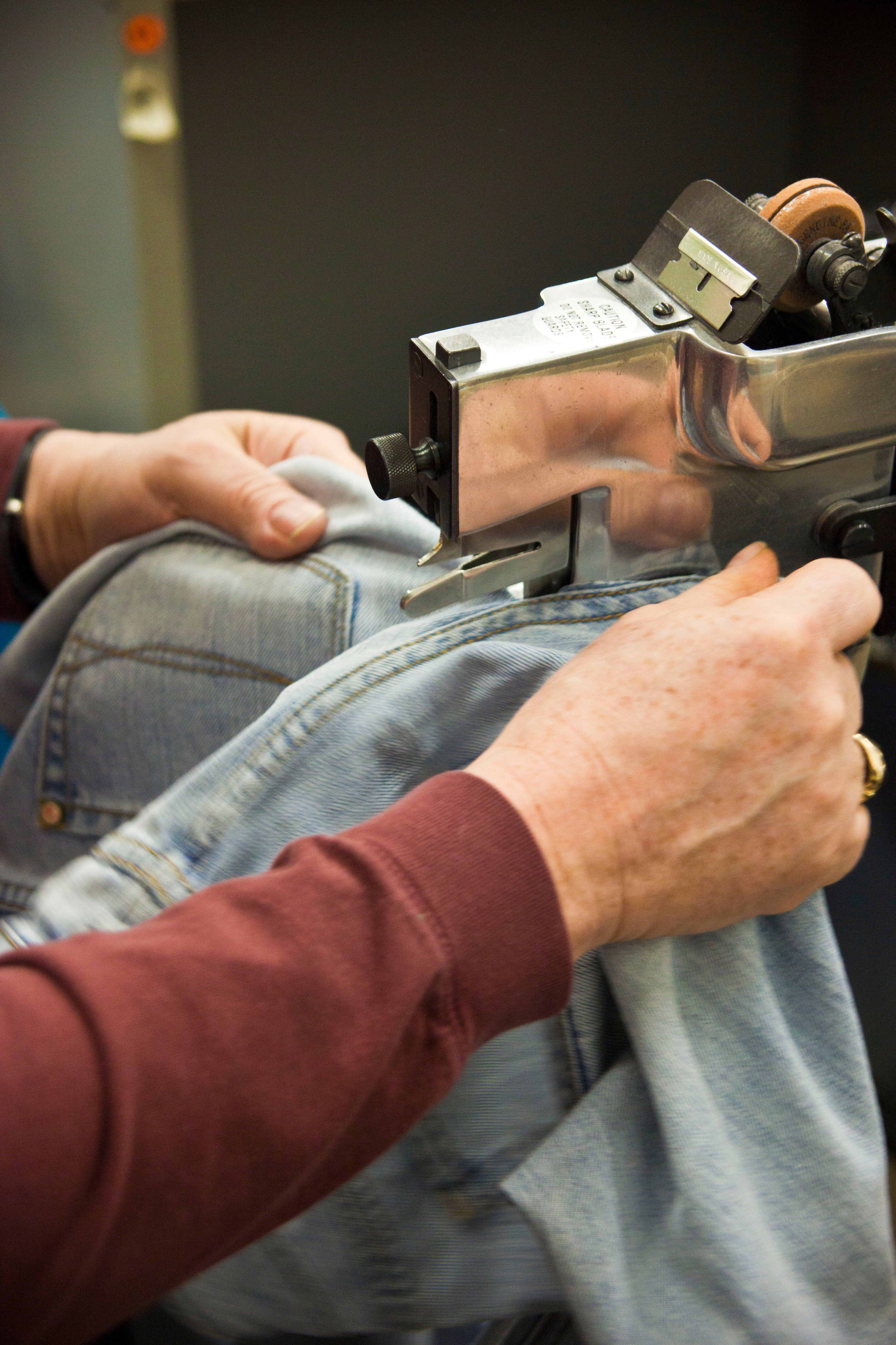 Seams, pockets, and zippers are cut off of the jeans and used for other projects. Very little of the denim is thrown out.