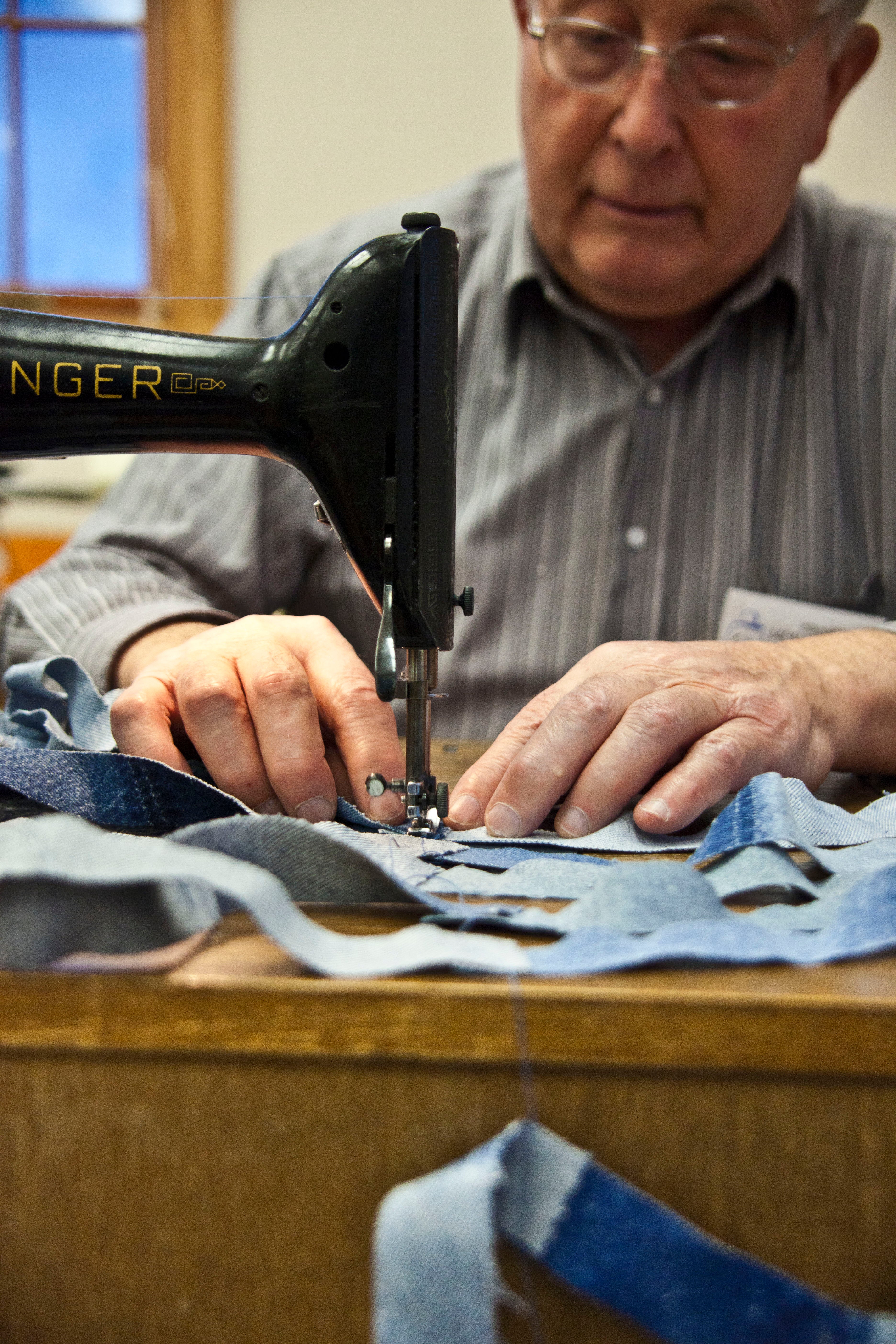 Once the strips are cut, they need to be sewn together in one long piece to weave.