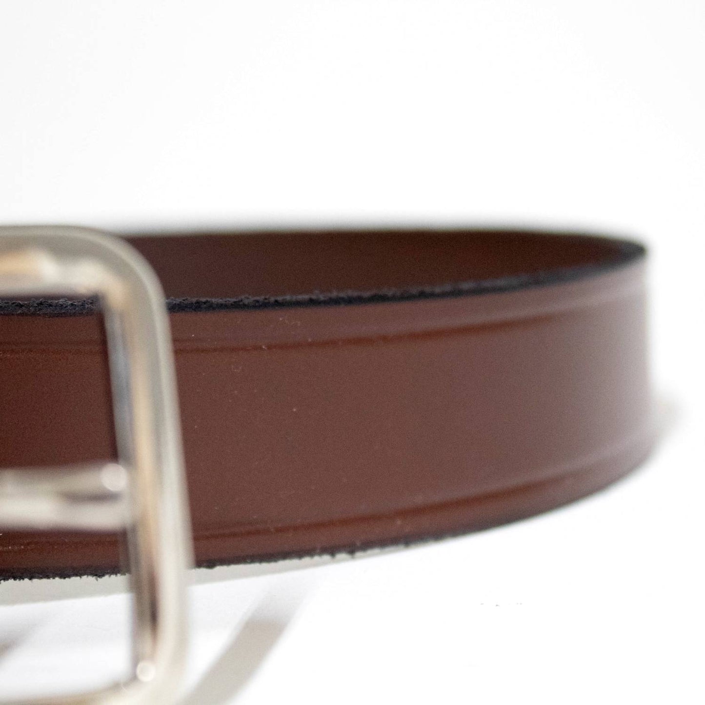 Close-up of a handcrafted Amish made brown genuine cowhide leather belt with a sturdy chrome buckle, featured in Health & Wellness, Clothing and Accessories, USA Made, Amish Made, Best Sellers, and Promo Eligible collections.