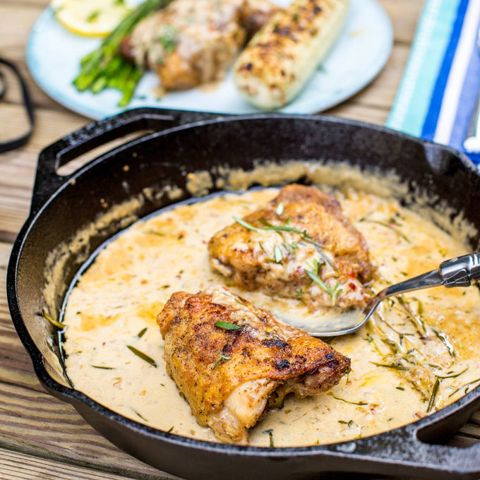 Handcrafted cast iron round pan with short side handles cooking seared chicken in creamy herb sauce, ideal for Kitchen & Food, Cookware, Cast Iron, Best Sellers, Promo Eligible collections.