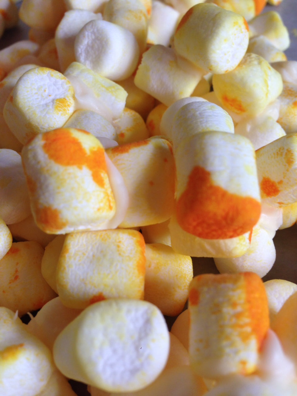 marshmallows and yellow food coloring
