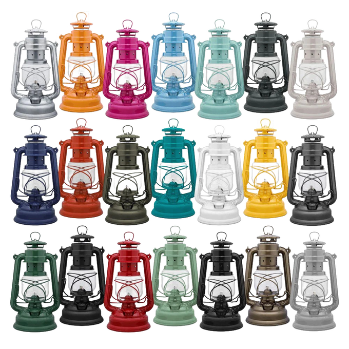 A handcrafted assortment of vibrant Feuerhand galvanized oil lanterns in various colors, featuring thermal heat-resistant SUPRAX globes, ideal for Lamps & Lighting, Camping, and Emergency Supplies collections.