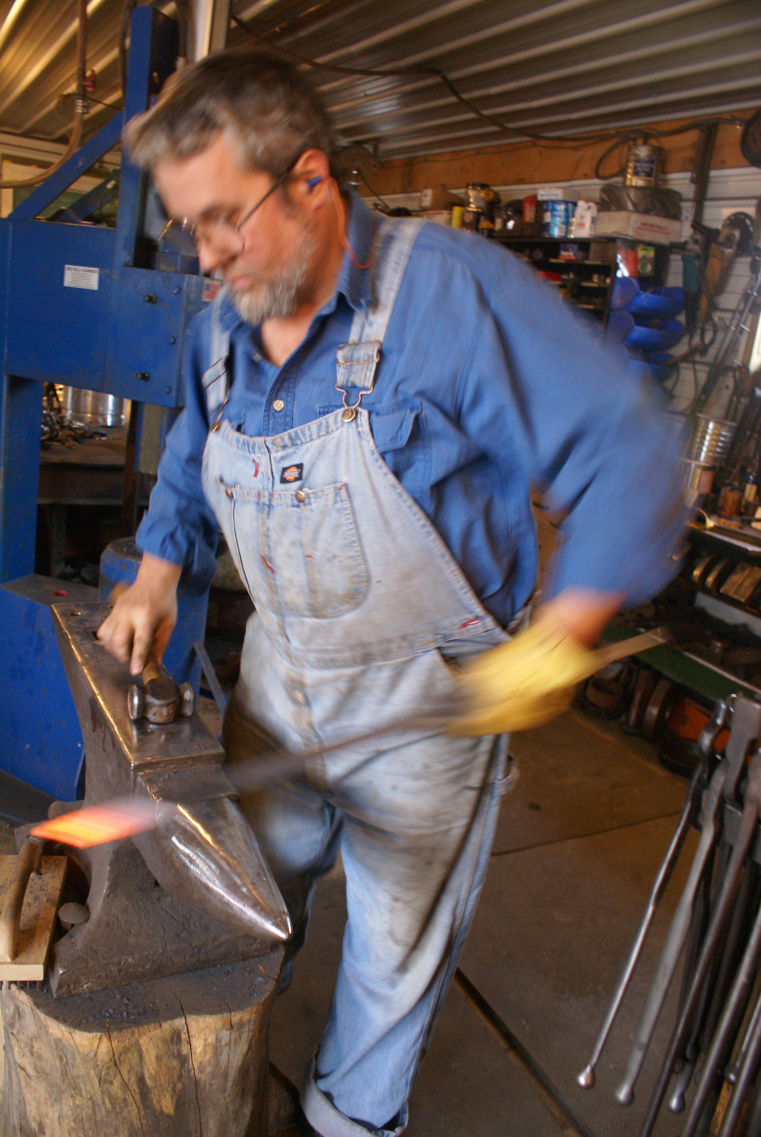 Doug rough shapes a piece of bar stock that Danielle will later bend into a standing hook.