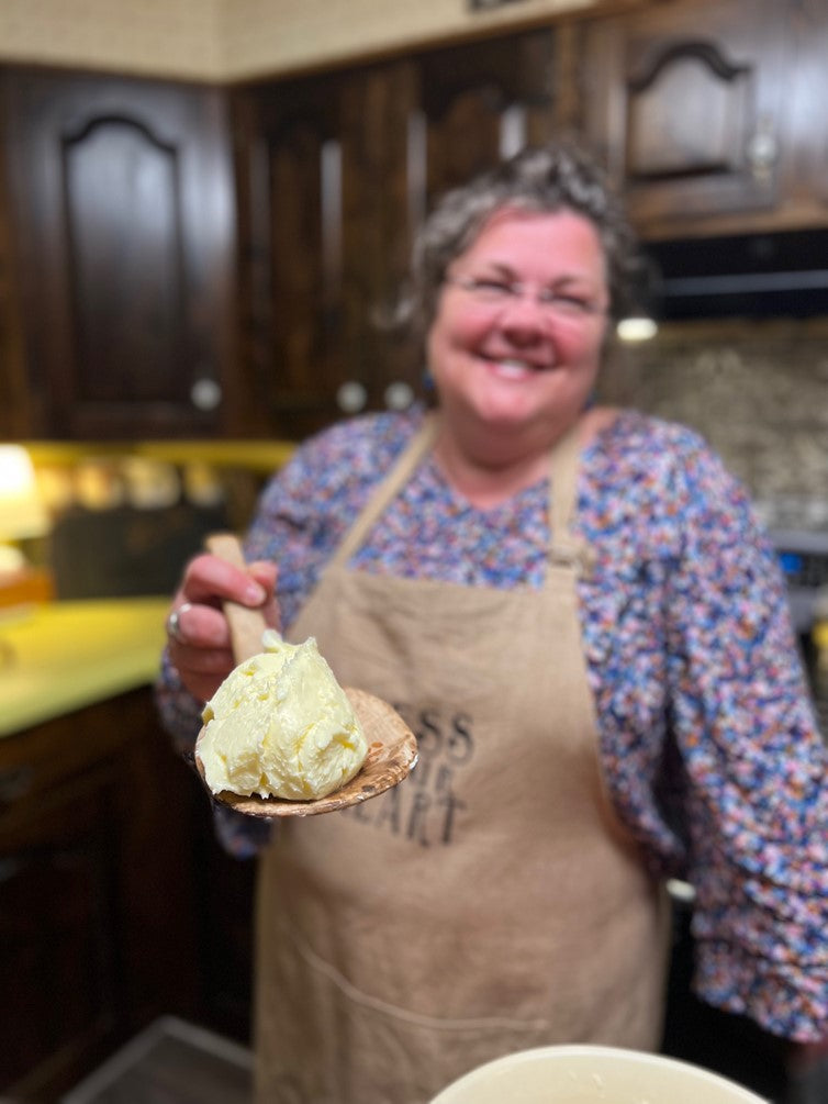 Mrs. Katie making butter