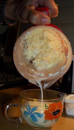 Butter comes together quickly at the end! Pour off as much skim milk as possible.