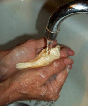 Rinse butter under running water until water is clear. Alternatively, squeeze in large bowl or container, changing water often.