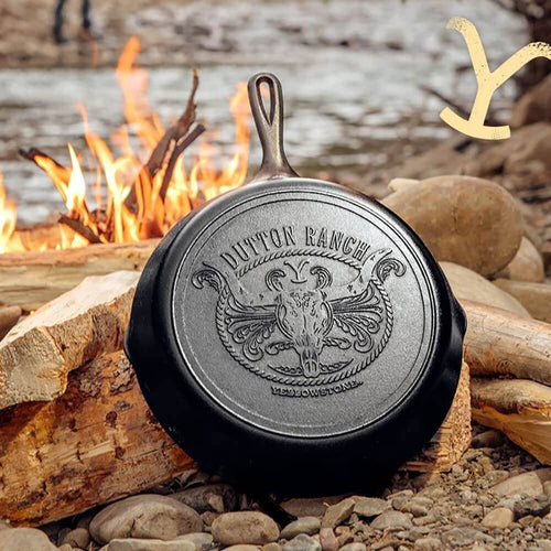 Handcrafted cast iron skillet with an embossed Dutton Ranch logo featuring a steer skull and rope design, made in USA, ideal for Kitchen & Food, Cookware, Cast Iron, USA Made, and Best Sellers collections.
