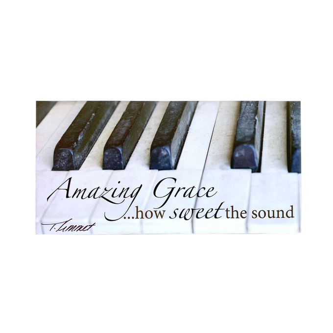 Handcrafted 5"x7" plaque featuring a close-up of piano keys with the uplifting phrase "Amazing Grace... how sweet the sound," ideal for Home & Decor, Best Sellers, and Promo Eligible collections.