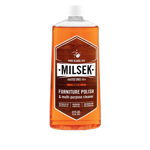 Amber liquid in a clear plastic bottle of wood furniture polish and multi-purpose cleaner with white screw cap, highlighting handmade quality and USA Made attributes for home care collections.