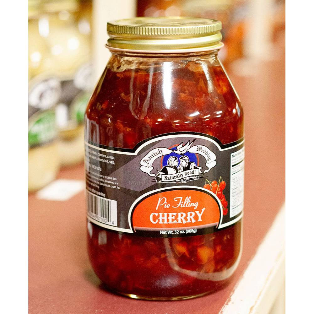 Handcrafted cherry pie filling in a glass jar with a gold lid, made in USA, naturally prepared without corn syrup, part of Kitchen & Food, Pantry, and Best Sellers collections.