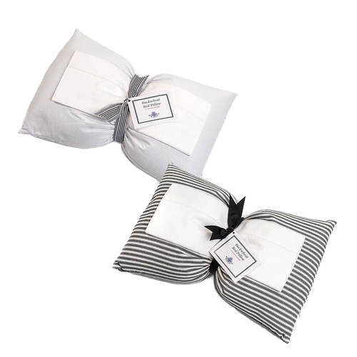 Two handcrafted buckwheat bed pillows, one solid white and one with gray and white stripes, tied with black ribbons and labels, part of Home & Decor and USA Made collections.