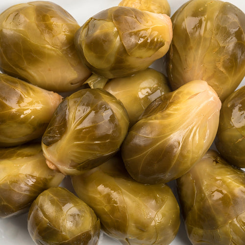 Close-up of glossy pickled Brussels sprouts with a tangy, spiced finish, handcrafted and made in USA, ideal for Kitchen & Food, Pantry, Best Sellers, and Promo Eligible collections.
