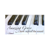 Handcrafted scenic magnet featuring close-up of worn piano keys with the uplifting phrase “Amazing Grace…how sweet the sound,” perfect for Home & Decor, Best Sellers, and Promo Eligible collections.