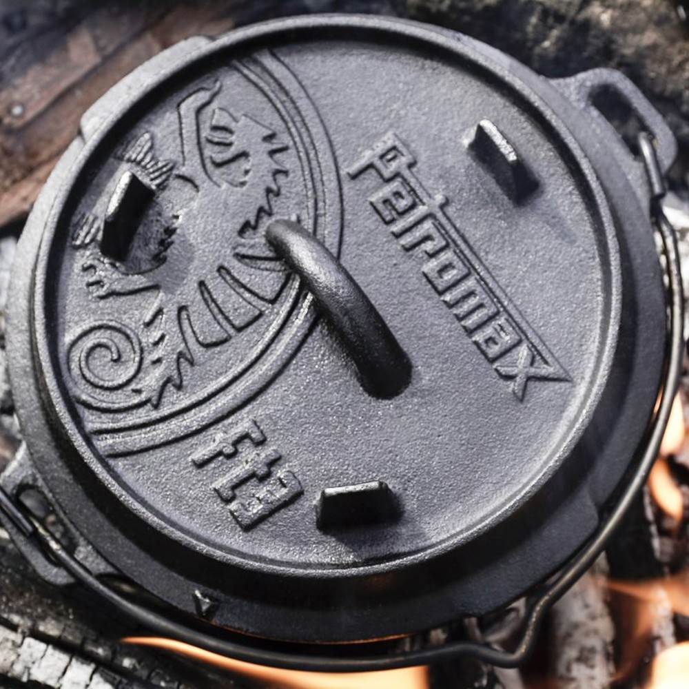 Close-up of a sturdy cast iron Dutch oven lid embossed with the Petromax logo and decorative details, crafted for durable outdoor and indoor cooking, featured in Kitchen & Food, Cookware, Cast Iron, Best Sellers, and Promo Eligible collections.