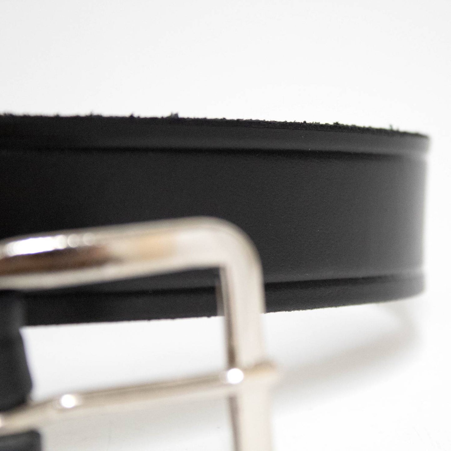 Close-up of a handcrafted Amish made black genuine cowhide leather belt, 1-1/4 inches wide with a polished chrome buckle, featured in Health & Wellness, USA Made, Clothing and Accessories, Best Sellers collections.
