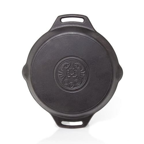 Top view of a durable cast iron skillet with two elongated handles and embossed emblem, handcrafted for versatile use in farm, garden, kitchen, camping, cookware, and cast iron collections.
