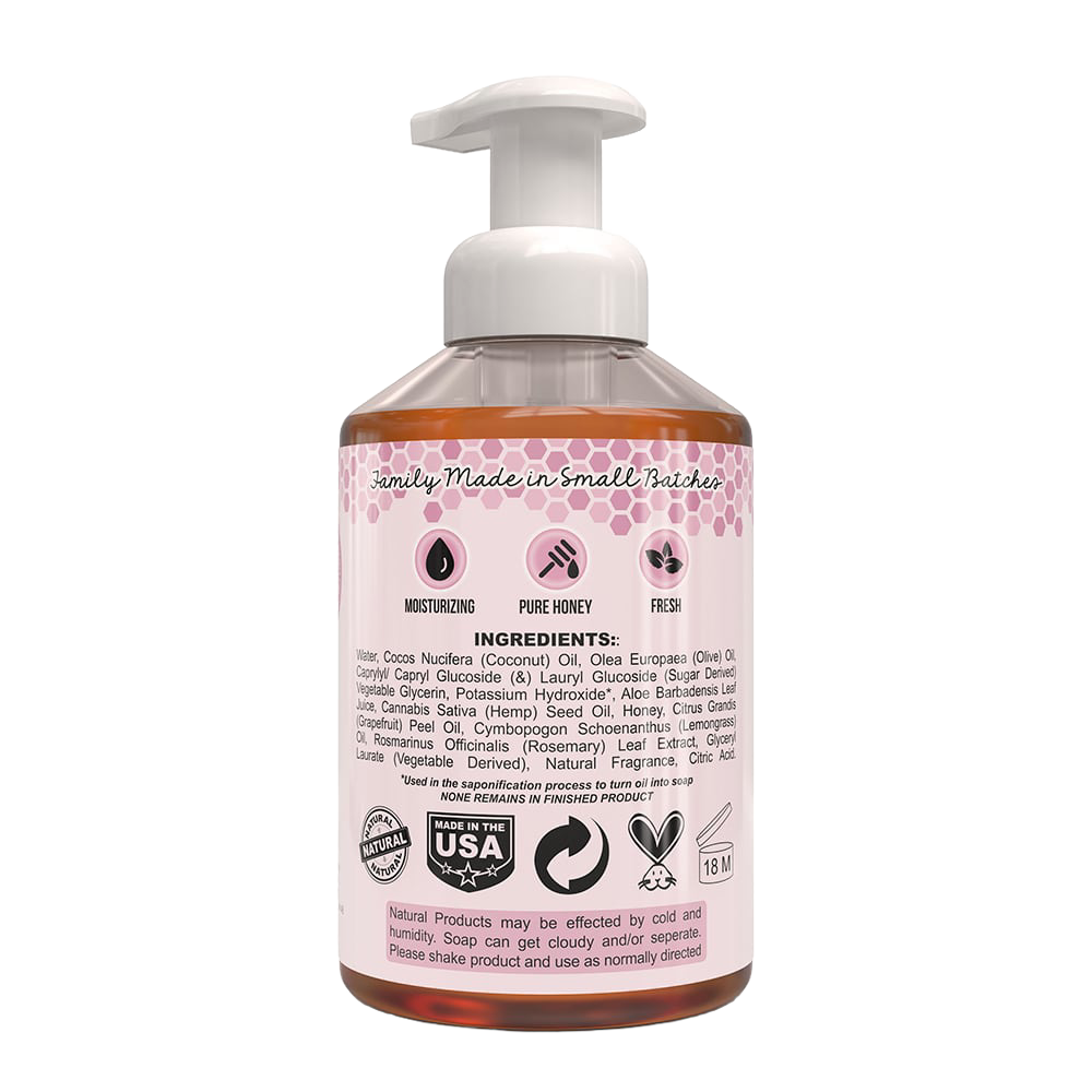 Clear plastic pump bottle of natural foaming hand soap with label listing moisturizing, pure honey, and fresh qualities, made in USA, featured in Health & Wellness and Soaps collections.
