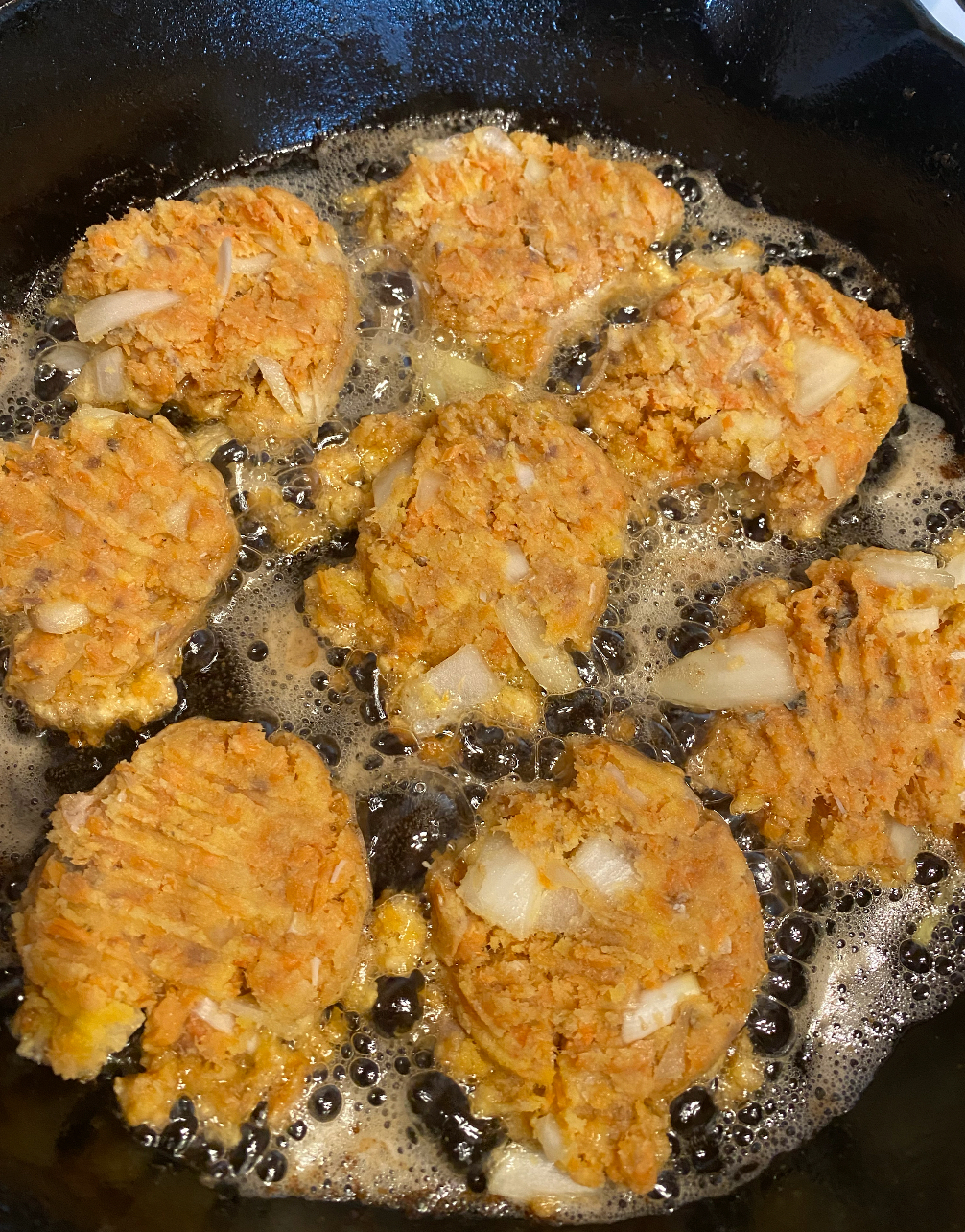 Salmon patties cooking on the wood stove