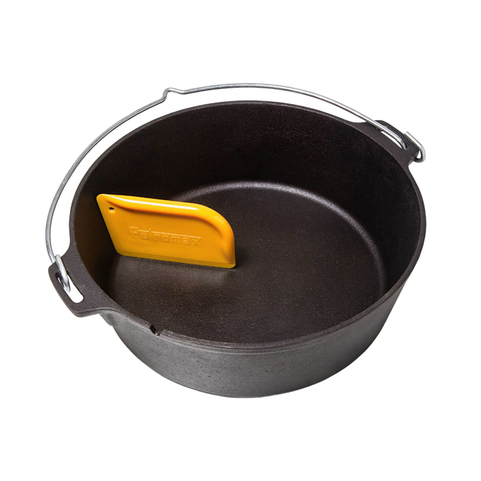 Yellow pan scraper designed to gently remove stuck-on food from cast iron cookware without damaging seasoning, shown inside a seasoned black cast iron Dutch oven, ideal for Kitchen & Food, Cookware, Cast Iron, Best Sellers, and Promo Eligible collections.