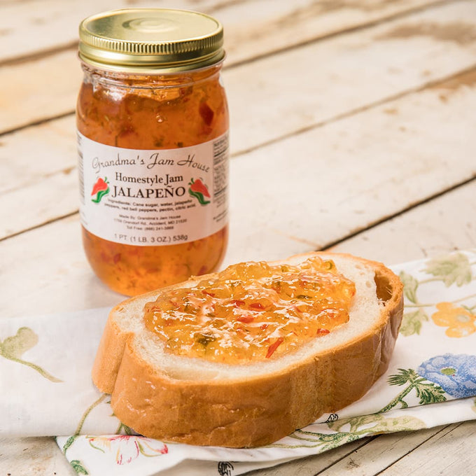 Handcrafted jar of jalapeno homestyle jam with gold lid and white label featuring chili pepper illustrations, made in USA, ideal for Kitchen & Food, Pantry, Peanut Butter & Jellies, Best Sellers, and Promo Eligible collections.