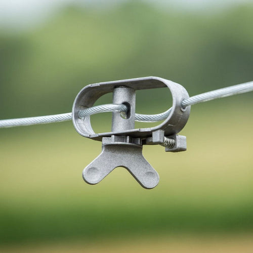 Close-up of a durable metal ratchet tensioner securing a steel clothesline wire, designed for easy tightening and ideal for home and laundry supplies collections.
