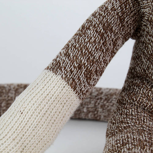 Close-up of a handcrafted arm on a brown and cream knit sock monkey made in USA, featured in Toys, Books & Games, Children's Toys, Indoor Play, and Best Sellers collections.