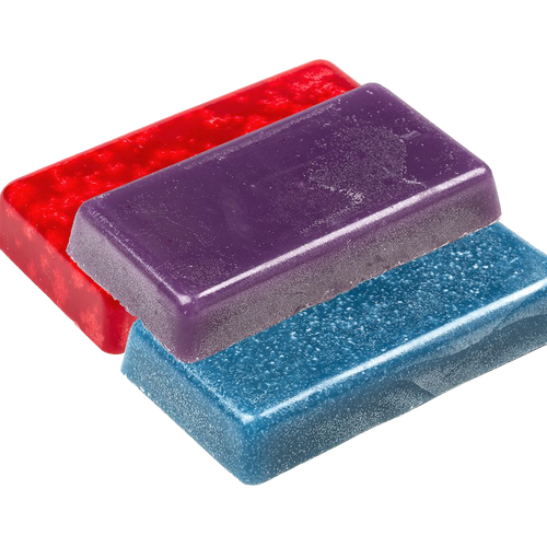 Three smooth blocks of colored scented candle wax in red, purple, and blue, handcrafted for candlemaking supplies and ideal for lamps and lighting collections.