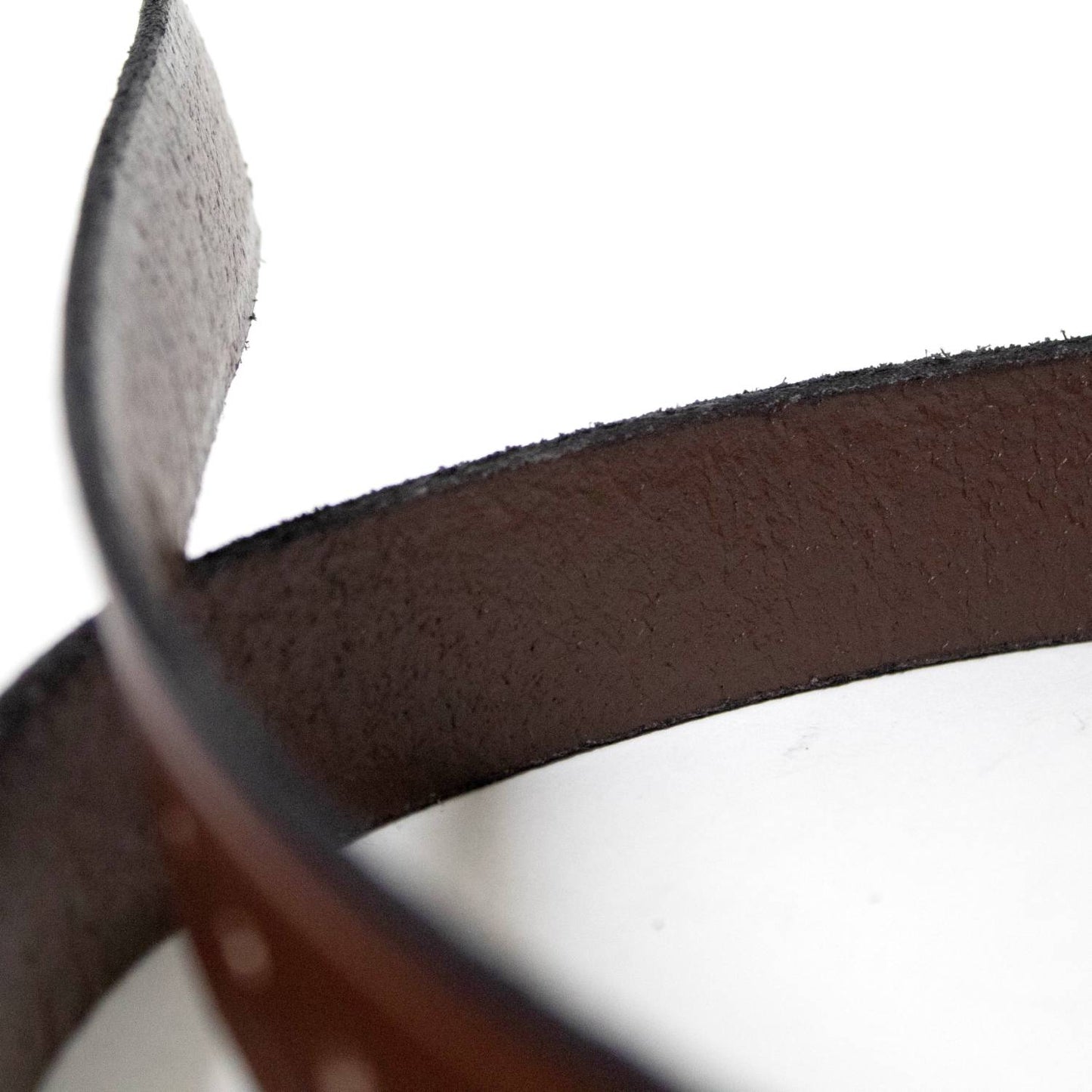 Close-up view of the textured underside and smooth top surface of a handcrafted Amish made genuine cowhide leather belt, featured in Health & Wellness, Clothing and Accessories, USA Made, Amish Made, Best Sellers, Promo Eligible collections.