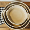 Set of nested beige stoneware bowls with handles, handcrafted in the USA, suitable for Kitchen & Food, Dinnerware, and Storage and Serving collections.