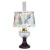 Handcrafted oil lamp featuring a clear glass bowl over an amethyst pedestal base with a floral and peacock patterned shade, perfect for lamps & lighting and table lamps collections.