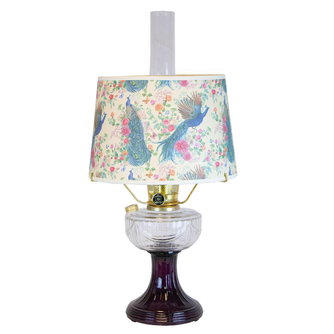 Handcrafted oil lamp featuring a clear glass bowl over an amethyst pedestal base with a floral and peacock patterned shade, perfect for lamps & lighting and table lamps collections.