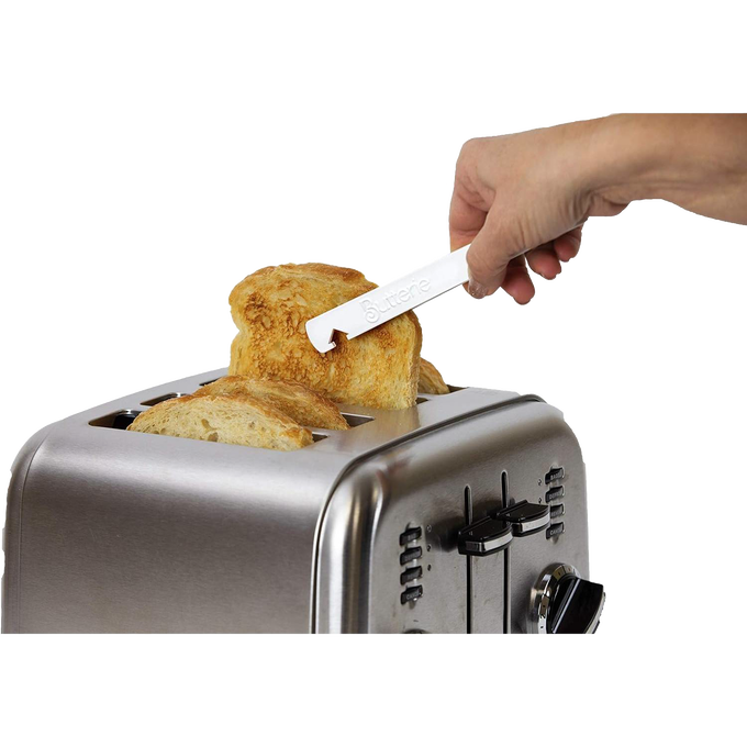 Hand using white Butterie toaster tongs with serrated teeth to safely remove toasted bread from stainless steel toaster, part of Kitchen Gadgets and Kitchen Accessories collections.