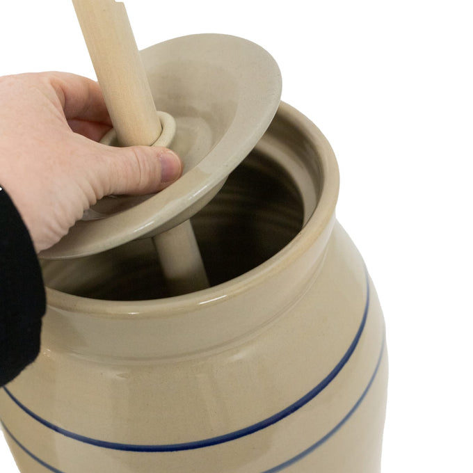 Handcrafted stoneware butter churn in natural stone color with smooth-sanded wooden dasher and traditional double blue stripes, made in USA, perfect for Kitchen & Food and Specialty Equipment collections.