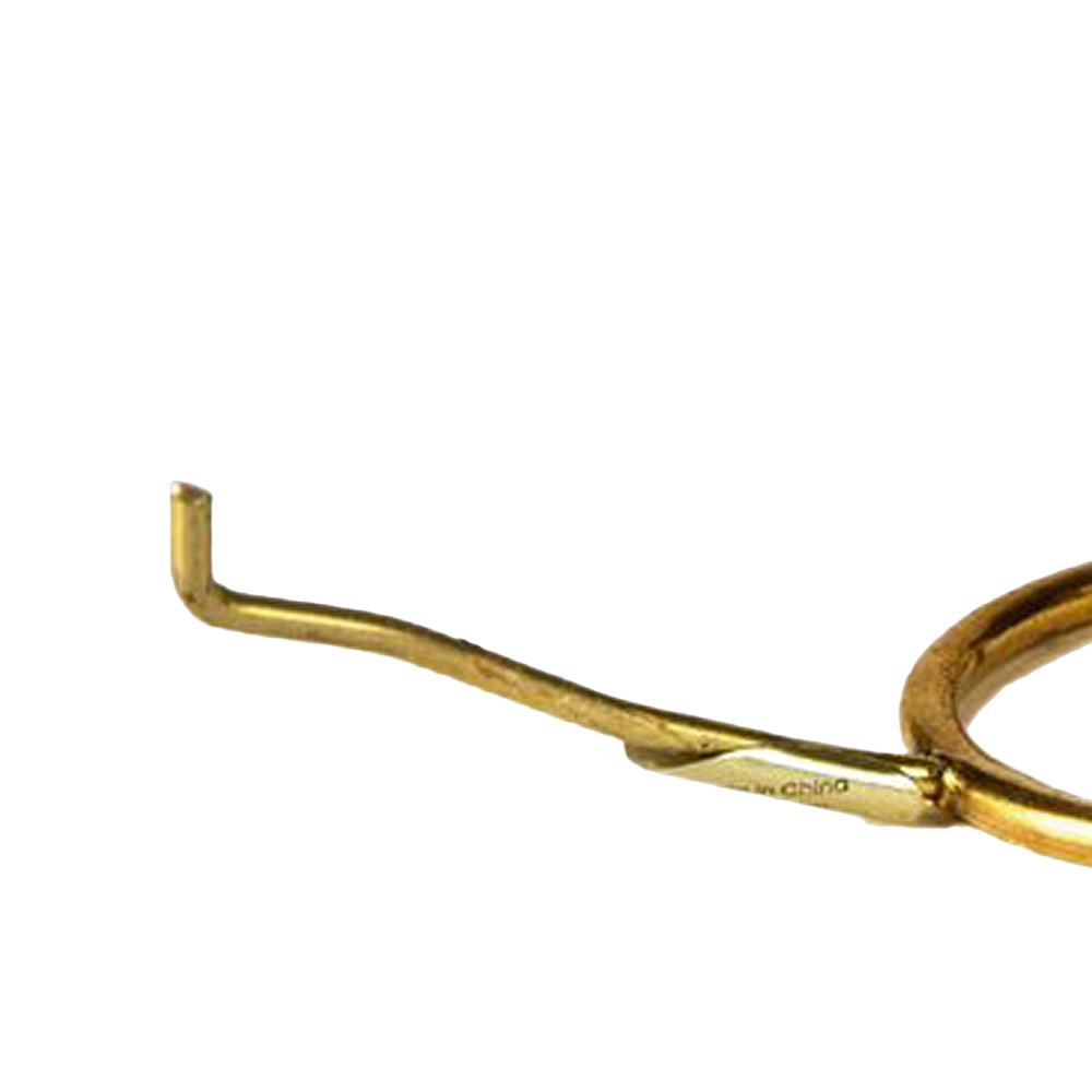 Close-up of a solid brass tripod arm with a curved tip, designed to support lamp shades, featured in Lamps & Lighting, Parts and Accessories, Shade Rings and Holders, Best Sellers, and Promo Eligible collections.