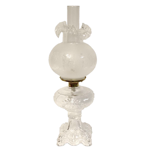 Handcrafted clear glass oil lamp with an intricately sculptured base and frosted etched chimney, featuring a heavy brass-plated burner, ideal for Lamps & Lighting, Oil Lamps, Table Lamps, Best Sellers, and Promo Eligible collections.
