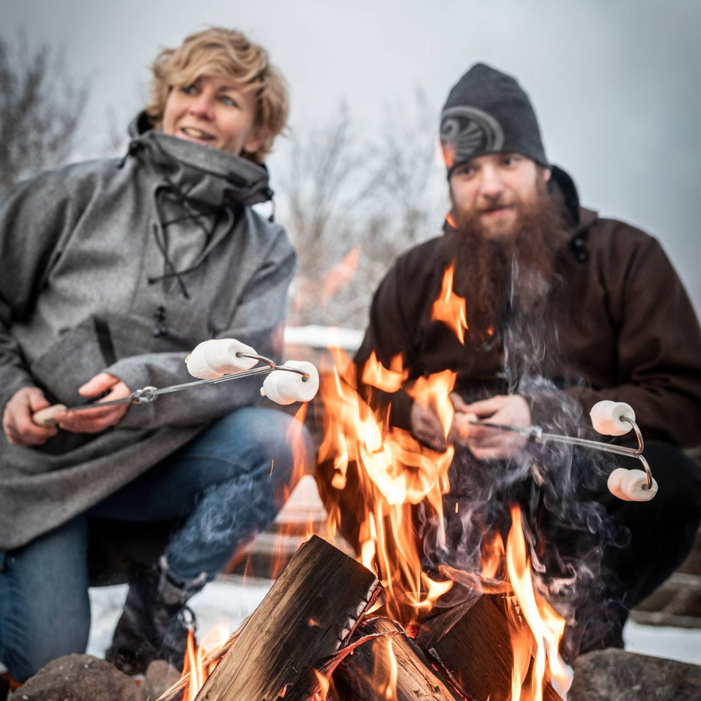 Unique handcrafted adjustable skewer with wooden handle roasting marshmallows over an open campfire, ideal for Farm, Garden & Tool, Camping, Best Sellers, and Promo Eligible collections.