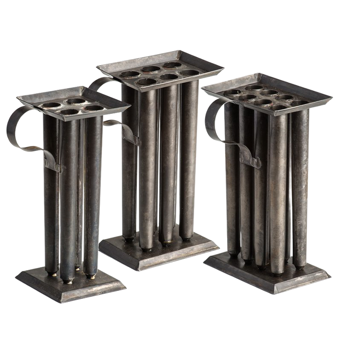Three handcrafted tin molds with multiple cylindrical compartments and sturdy handles, designed for creating sharp-tapered candles, ideal for Lamps & Lighting, Candles and Candlemaking, and Candlemaking Supplies collections.