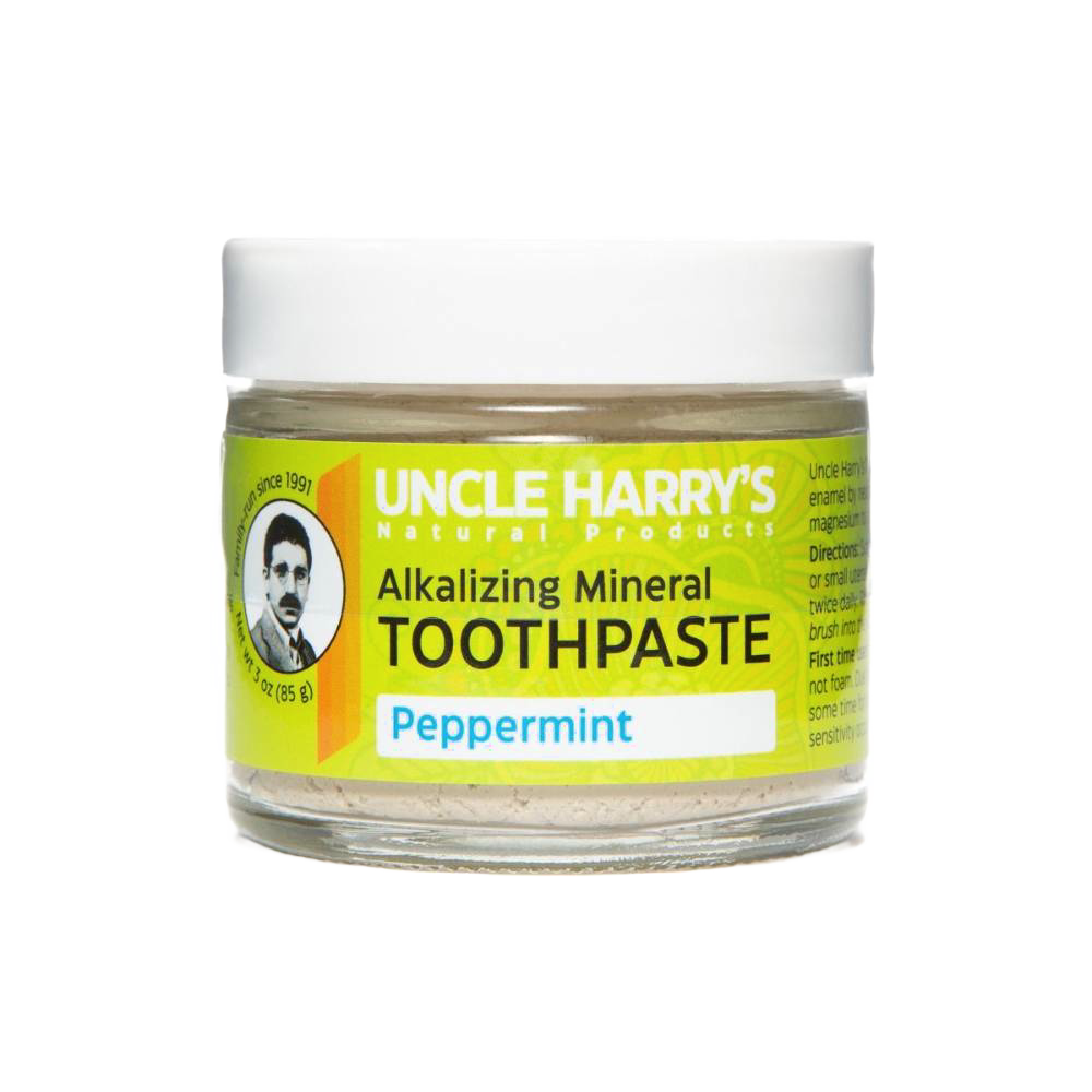 Handcrafted small glass jar of peppermint-flavored alkalizing mineral toothpaste with white lid and bright yellow label, featured in Health & Wellness, Grooming and Personal Hygiene, USA Made, and Best Sellers collections.