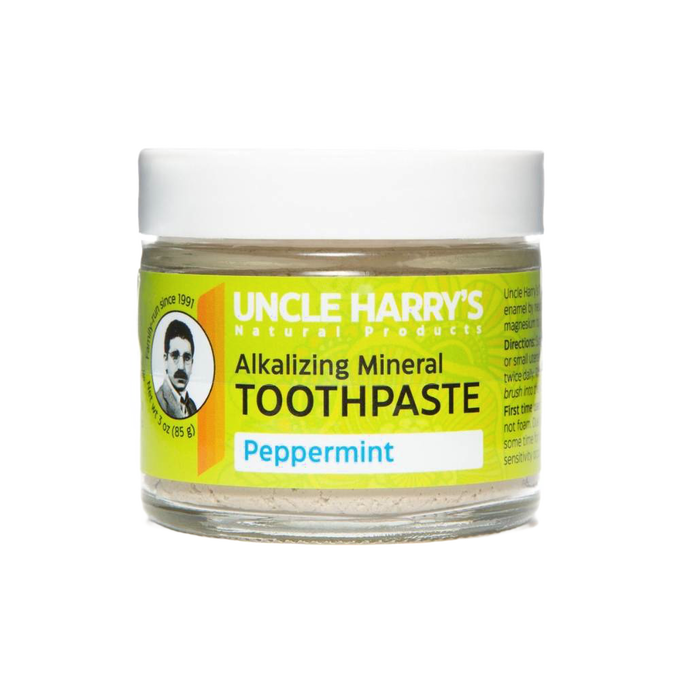 Handcrafted small glass jar of peppermint-flavored alkalizing mineral toothpaste with white lid and bright yellow label, featured in Health & Wellness, Grooming and Personal Hygiene, USA Made, and Best Sellers collections.