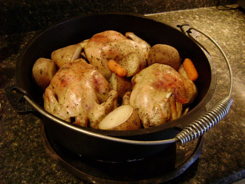Cornish hens in cast iron Dutch oven.