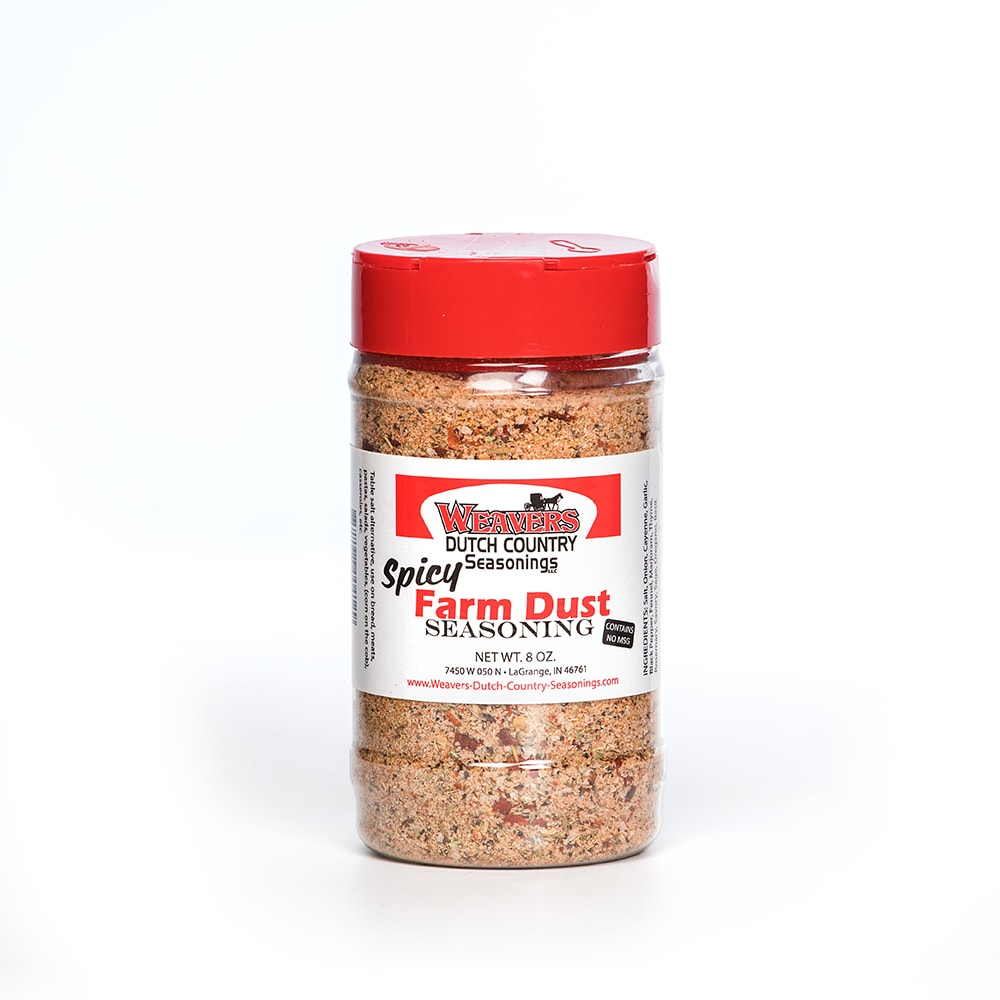 Clear plastic shaker with red lid containing spicy Farm Dust seasoning blend made in USA, ideal for Kitchen & Food, Food, Pantry, Best Sellers, and Promo Eligible collections.
