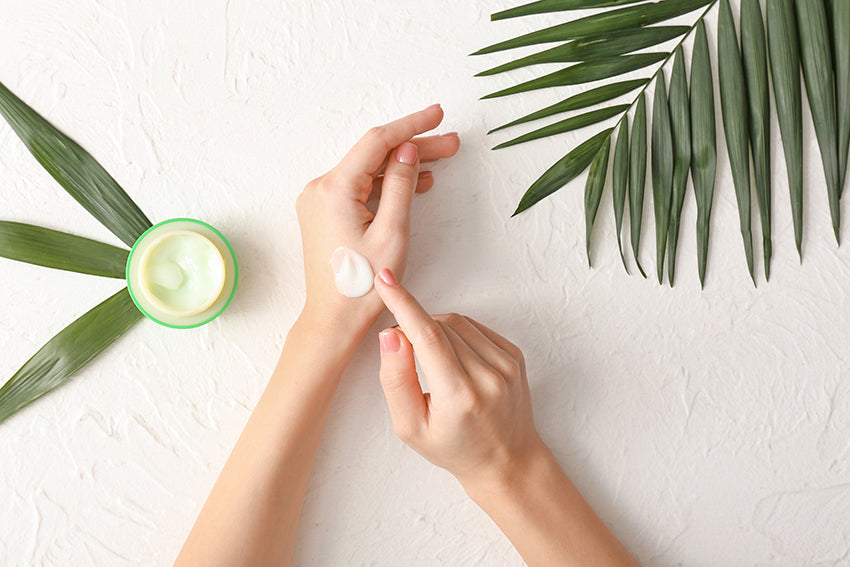 Putting lotion on hand