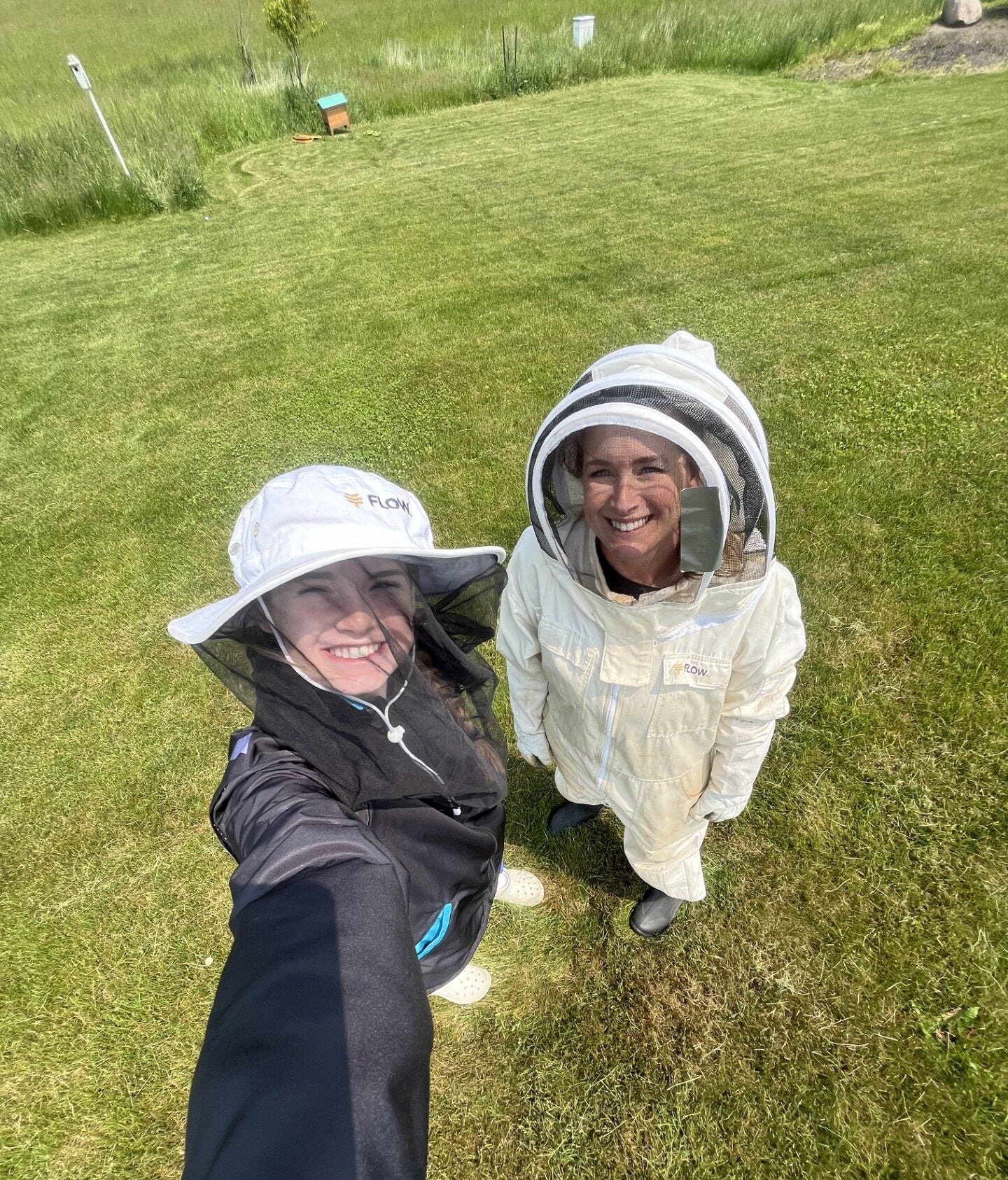 Family in beekeeping gear