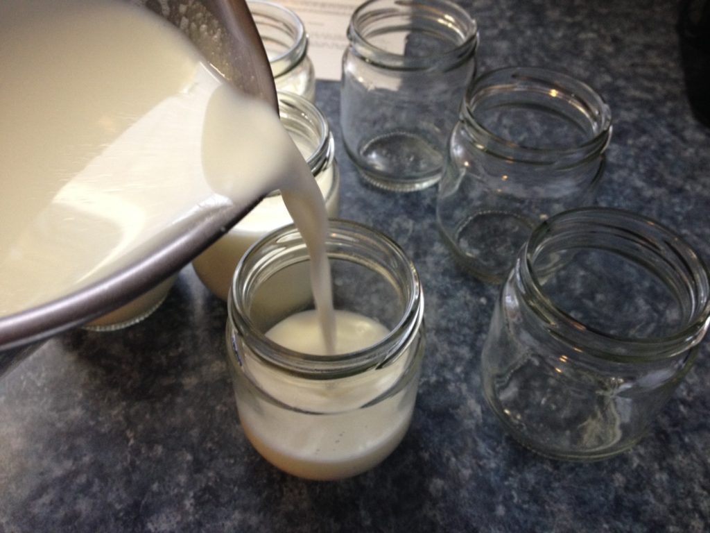 pouring milk into jars