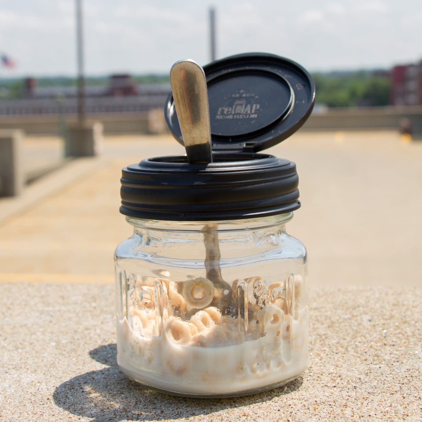 Handcrafted and made in USA, small glass jar with a black flip top lid holding cereal and milk, featured in Home & Decor, Kitchen Gadgets, and Best Sellers collections.