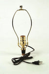 Brass-plated lamp harp and push-thru socket with adjustable cork adapter and six-foot cord, designed for electric light conversions; featured in Lamps & Lighting and Parts and Accessories collections.