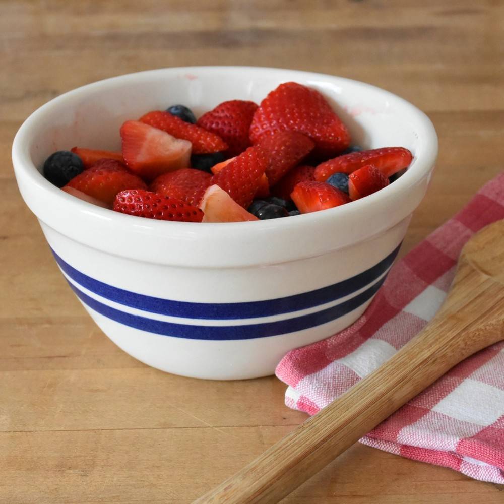 Handcrafted USA-made stoneware bowl with classic blue stripes, filled with fresh mixed berries, ideal for Kitchen & Food, Baking Supplies, Dinnerware, and Storage and Serving collections.